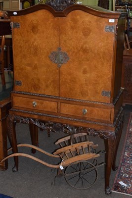 Lot 483 - A mid 20th century walnut cocktail cabinet, 103cm wide