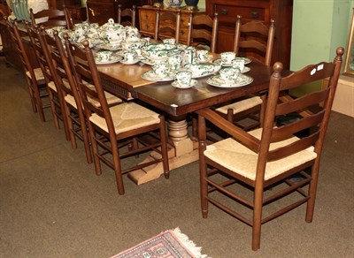 Lot 491 - A set of ten reproduction oak and rush seated ladder back chairs (including two carvers)