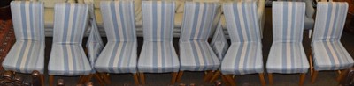 Lot 497 - A set of eight modern upholstered oak dining chairs, with removable blue striped covers