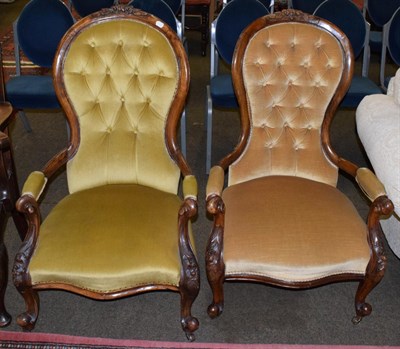 Lot 500 - A Victorian walnut framed armchair upholstered in yellow buttoned velvet; and a similar example (2)