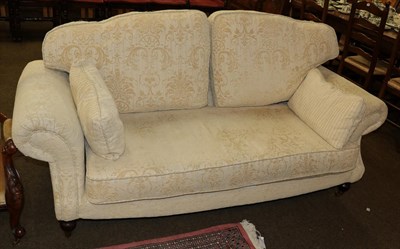 Lot 501 - A modern cream and floral two seater sofa, 200cm wide