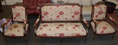 Lot 506 - A late 19th century walnut framed three piece suite recovered in floral fabric