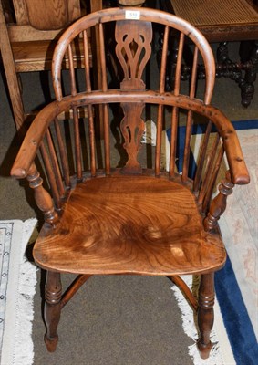 Lot 510 - An ash and elm Windsor chair with crinoline stretcher, bearing old paper label (cut down)