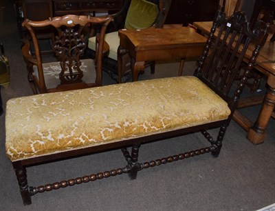 Lot 511 - A Victorian carved oak day bed with bobbin turned stretchers, 153cm long