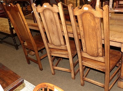 Lot 516 - A set of six reproduction oak panel back dining chairs