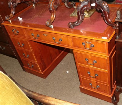 Lot 525 - A reproduction yew wood double pedestal desk