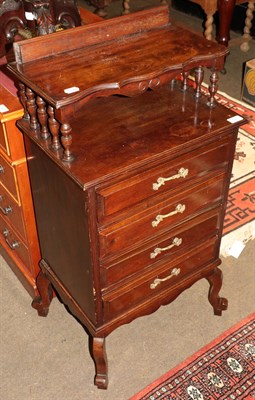 Lot 526 - An early 20th century four drawer chest with spindle turned shelf