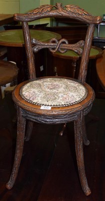 Lot 532 - A late 19th century Continental carved chair in the form of a tree branch