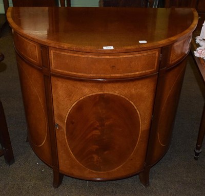 Lot 548 - A reproduction mahogany demi-lune side cabinet, 94cm wide