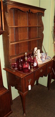 Lot 554 - A George III oak dressing table fitted three drawers above an arched apron, 100cm wide; and an...