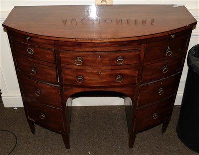 Lot 560 - A late George III mahogany bow fronted dressing chest with brushing slide, 101cm wide