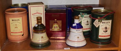 Lot 314 - Eleven Bells commemorative decanters and one Famous Grouse (12)