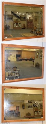 Lot 562 - Three modern pine framed bevelled glass mirrors