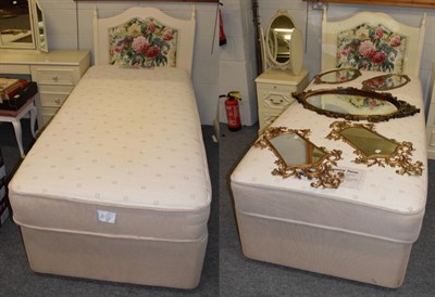 Lot 563 - A pair of Slumberland memory foam 3ft beds with floral padded headboards