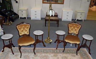 Lot 567 - A pair of rosewood framed side chairs upholstered in yellow velvet; five marble top occasional...