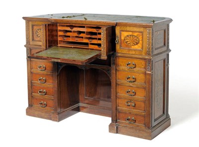 Lot 1251 - An Unusual Walnut and Floral Marquetry Wooton Style Desk, circa 1910, the breakfront top inset...