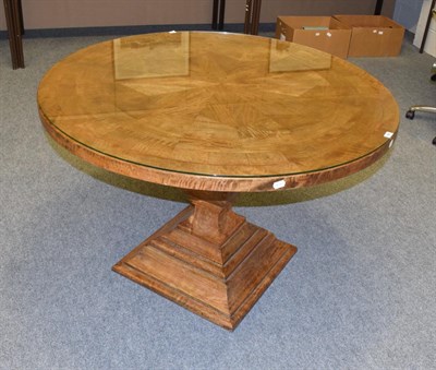 Lot 586 - A Barker & Stonehouse Flagstone collection hardwood circular dining table, 120cm diameter