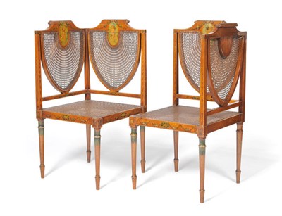 Lot 1261 - A Pair of Edwardian Satinwood and Painted Cane Seated Corner Chairs, the frames richly painted with