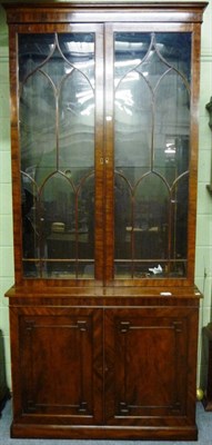 Lot 1262 - A Mahogany Glazed Bookcase, early 19th century with alterations, the upper section with a pair...