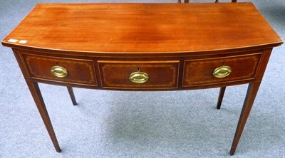 Lot 1269 - A George III Mahogany and Boxwood Strung Bowfront Side Table, circa 1800, the three frieze...