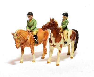 Lot 187 - Beswick Girl on Pony, model No. 1499, skewbald gloss and Boy on Pony, model No. 1500, palomino...