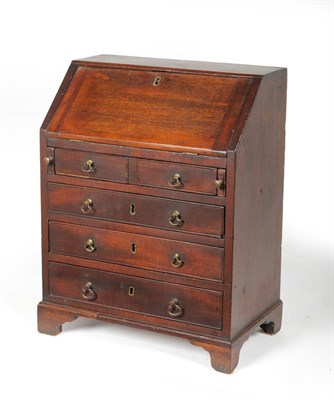 Lot 1272 - A George III Mahogany Miniature Bureau, late 18th century, the fall enclosing pigeon holes around a