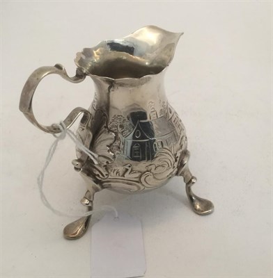 Lot 3004 - A George II Silver Cream-Jug, by Thomas Rush, London, Probably 1746, pear-shaped and on pad...