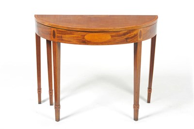 Lot 1274 - A George III Mahogany, Satinwood Banded and Boxwood Strung Foldover Tea Table, late 18th...