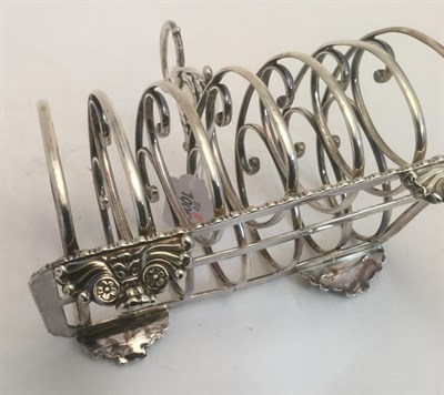 Lot 3015 - A George IV Silver Toast-Rack, by John and Thomas Settle, Gunn and Co., Sheffield, 1826, oblong and