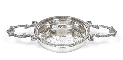 Lot 3020 - A George IV Silver Lemon-Strainer, by John Reily, London 1821, the bowl pierced circular and...