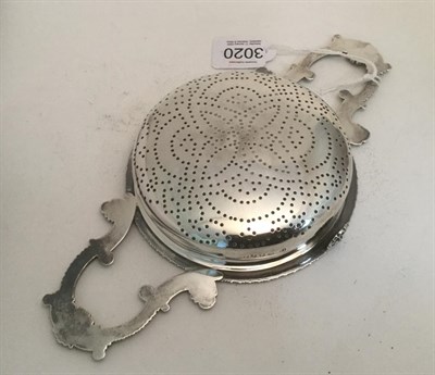 Lot 3020 - A George IV Silver Lemon-Strainer, by John Reily, London 1821, the bowl pierced circular and...