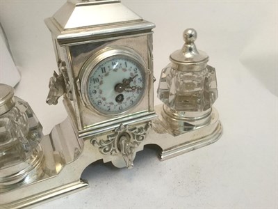 Lot 3037 - A Silver-Plated Inkstand Timepiece, 20th Century, oblong, the base with rests for the two...
