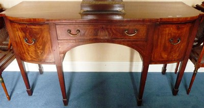 Lot 1277 - A George III Mahogany, Tulipwood Banded and Boxwood Strung Sideboard, circa 1800, of breakfront...