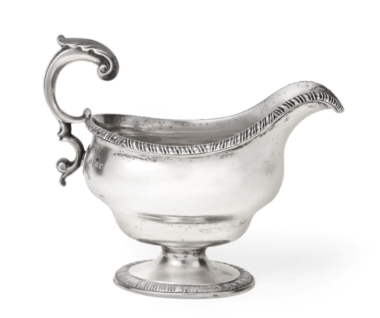 Lot 3051 - A George V Silver Sauceboat, by Stanley and Thomas Shapland, London, 1930, bombé oval and on...