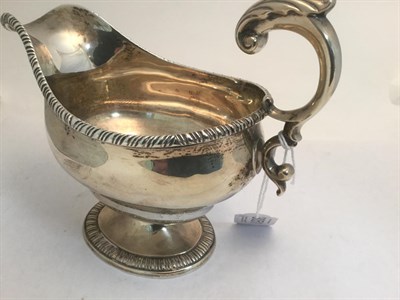 Lot 3051 - A George V Silver Sauceboat, by Stanley and Thomas Shapland, London, 1930, bombé oval and on...