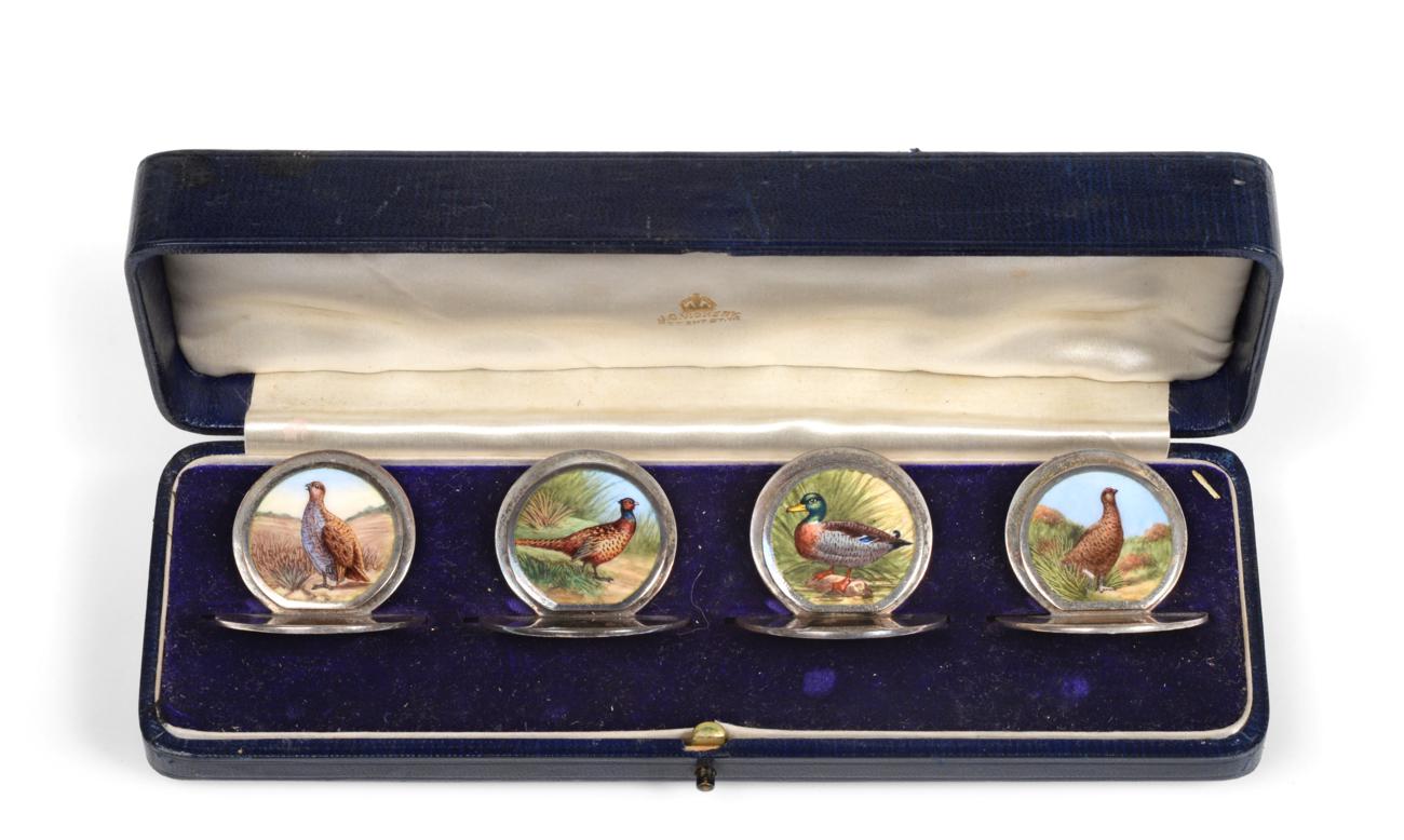 Lot 3053 - A Set of Four George V Enamelled Silver Place-Card Holders, by John Collard Vickery, Chester, 1911