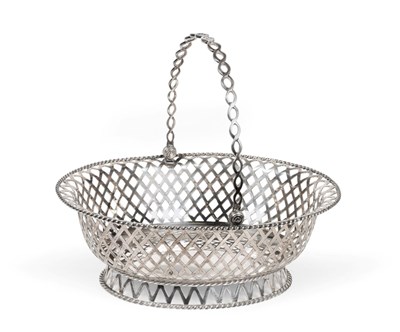 Lot 3127 - A George V Silver Basket, by William Lister and Sons, London, 1918, oval and on conforming...