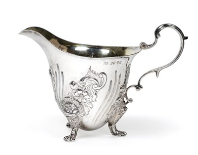 Lot 3130 - A Victorian Silver Cream-Jug, by Edward Farrell, London, 1839, helmet shaped and on three lion-mask