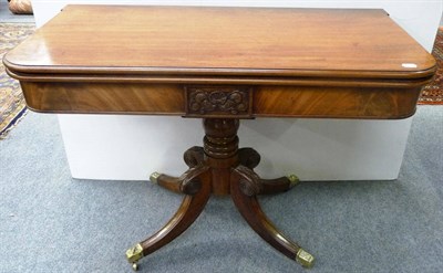 Lot 1287 - A Regency Mahogany Foldover Card Table, circa 1820, the swivel top above a central tablet with...