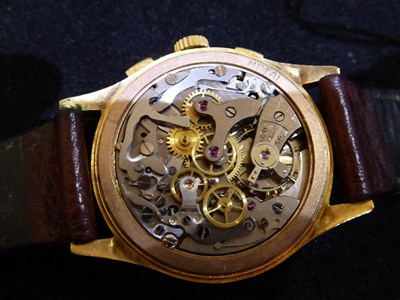 Lot 3202 - An 18 Carat Gold Chronograph Wristwatch, signed Exactus, circa 1950, lever movement, silvered...