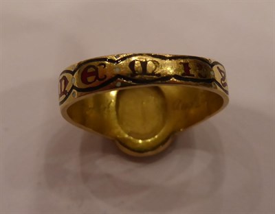 Lot 3224 - A Diamond and Enamel Mourning Ring, rose cut diamonds in the form of a floral motif on a black...