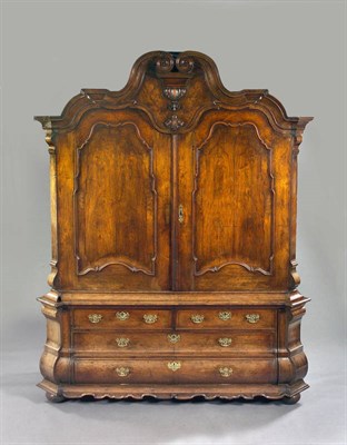 Lot 1296 - A Fine 18th Century Dutch Walnut Armoire, the shaped scrolled pediment and inlaid tympanum over two