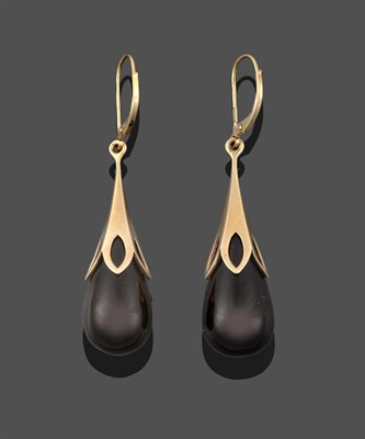 Lot 3227 - A Pair of 9 Carat Gold Jet Drop Earrings, a teardrop shaped jet bead suspended from a yellow...