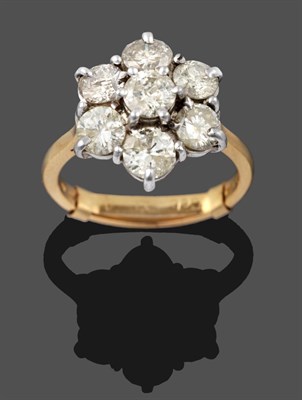 Lot 3231 - An 18 Carat Gold Diamond Cluster Ring, seven round brilliant cut diamonds in white claw...