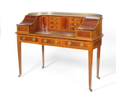 Lot 1297 - An Edwardian Sheraton Revival Mahogany and Satinwood Banded Carlton House Desk, early 20th century