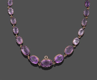 Lot 3238 - A 19th Century Amethyst Rivière Necklace, thirty graduated oval cut amethysts in yellow collet...