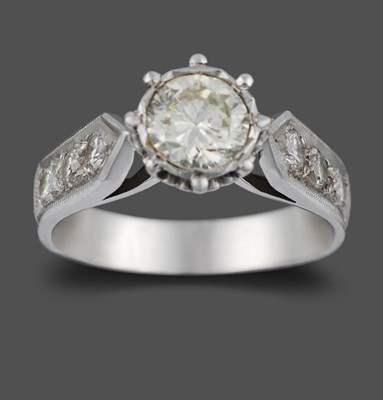 Lot 3252 - An 18 Carat White Gold Diamond Solitaire Ring, the round brilliant cut diamond in a claw and rubbed