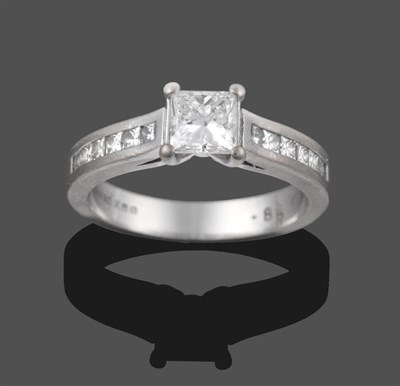 Lot 3258 - An 18 Carat White Gold Diamond Solitaire Ring, the princess cut diamond in a claw setting, to...