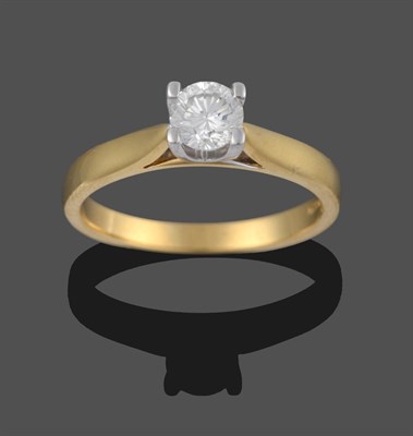 Lot 3275 - An 18 Carat Gold Diamond Solitaire Ring, a round brilliant cut diamond in a white claw setting,...
