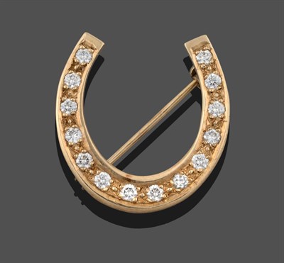 Lot 3283 - A 9 Carat Gold Diamond Horseshoe Brooch, the horseshoe motif set throughout with round...